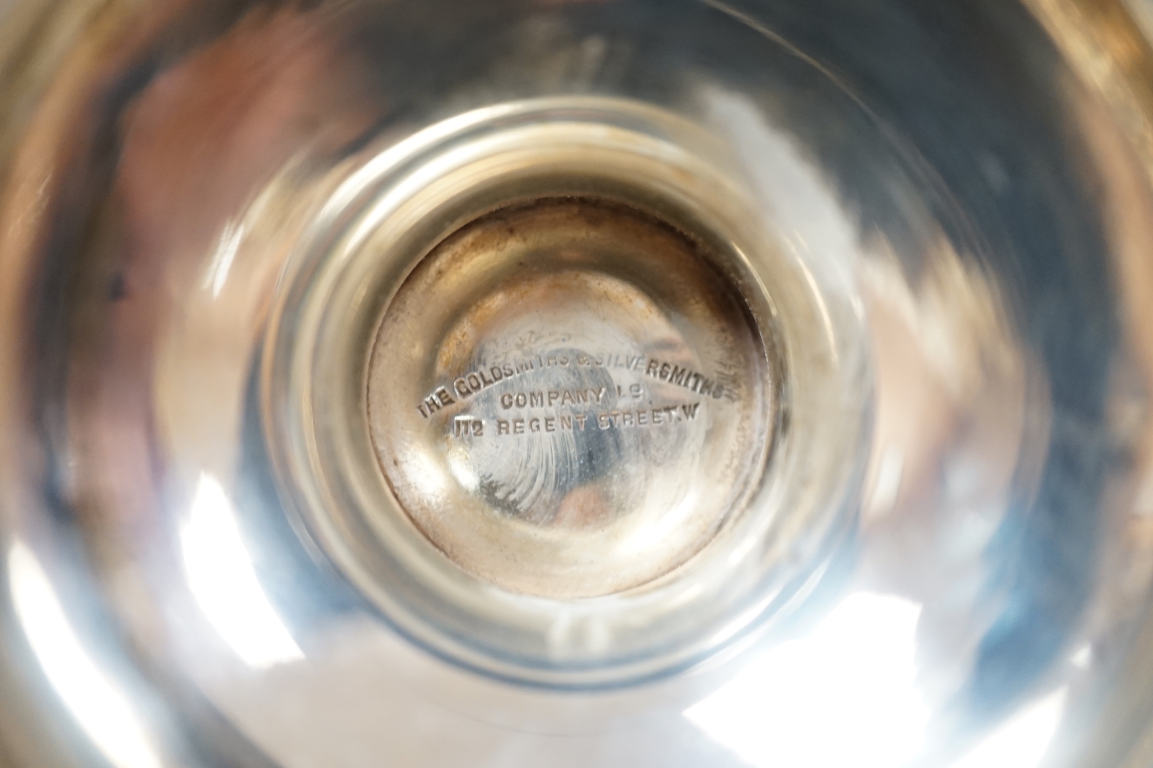 A George V silver two handled vase, Goldsmiths & Silversmiths Co Ltd, London, 1932, 16.2cm, 10oz and a spill vase.